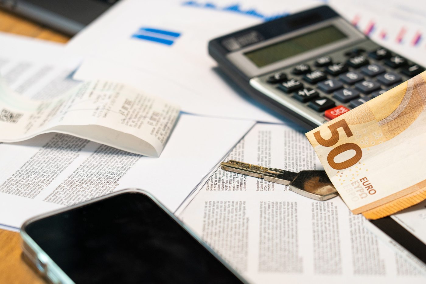 Receipts, a calculator and a fifty-euro note